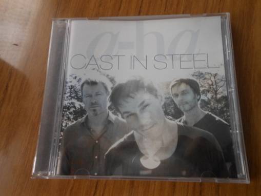 Okładka A-HA - CAST IN STEEL